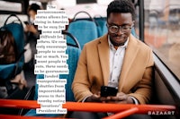 a man on a bus looking at his phone
